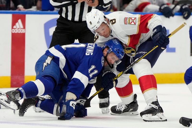 Florida Panthers right wing Kyle Okposo (8) takes down Tampa Bay Lightning center Luke Glendening (11) during the first period in Game 3 of an NHL hockey Stanley Cup first-round playoff series, Thursday, April 25, 2024, in Tampa, Fla. (AP Photo/Chris O'Meara)