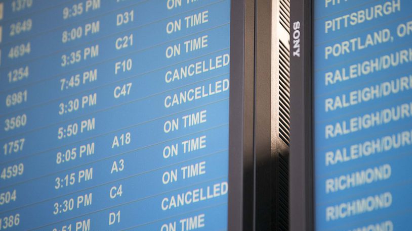 Canceled flights are displayed on an electronic screen inside the domestic terminal at Hartsfield-Jackson International Airport in Atlanta on Tuesday, April 14, 2020. (ALYSSA POINTER / ALYSSA.POINTER@AJC.COM)