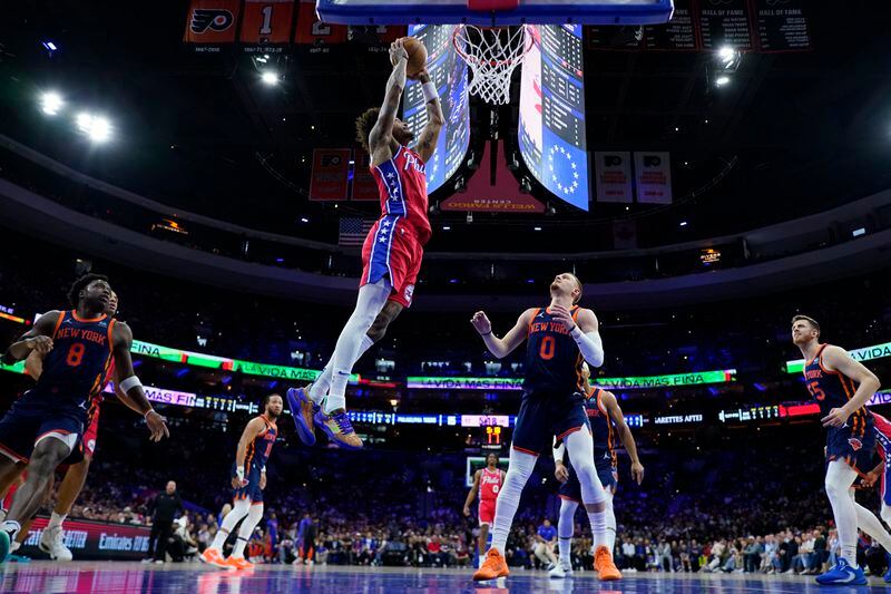 Philadelphia 76ers' Kelly Oubre Jr., left, goes up for a dunk as New York Knicks' Donte DiVincenzo looks on during the first half of Game 4 in an NBA basketball first-round playoff series, Sunday, April 28, 2024, in Philadelphia. (AP Photo/Matt Slocum)