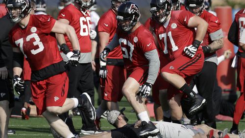 Falcons tackle Ryan Schraeder (73), guard Andy Levitre (67) and guard Wes Schweitzer (71) run through drills with teammates during a practice for the Super Bowl on Thursday, Feb. 2, 2017, in Houston. (AP Photo/Eric Gay)
