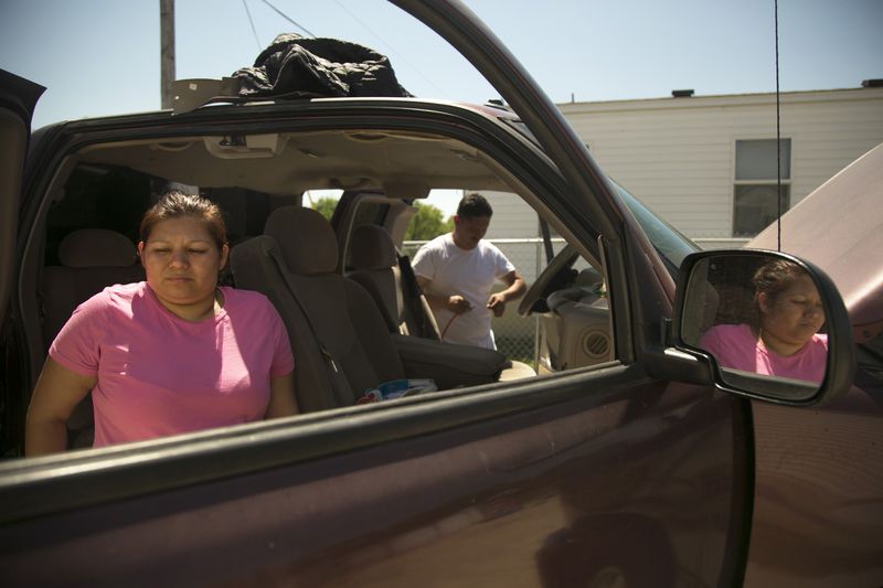 On March 26, 2017, Adriana Flores and her husband Roger Espinosa fix up their truck outside of their trailer home, located on the Kickapoo reservation south of Eagle Pass, Texas. Originally from the Great Lakes region, the Kickapoo Traditional Tribe of Texas also has reservations in northern Mexico. Adriana Flores owns a traditional Kickapoo home in Coahuila, which she visits monthly. "I have to follow my traditions and what my mom left me," she said.  Flores worries that if Donald Trump extends the current border wall, it may impede her ability to go back home to Mexico. "A wall will make everything harder," she said. (RESHMA KIRPALANI / AMERICAN-STATESMAN)