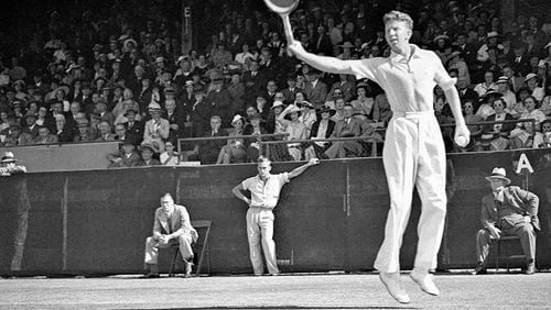 Budge in 1937 following through on his legendary backhand. (State Library of New South Wales)