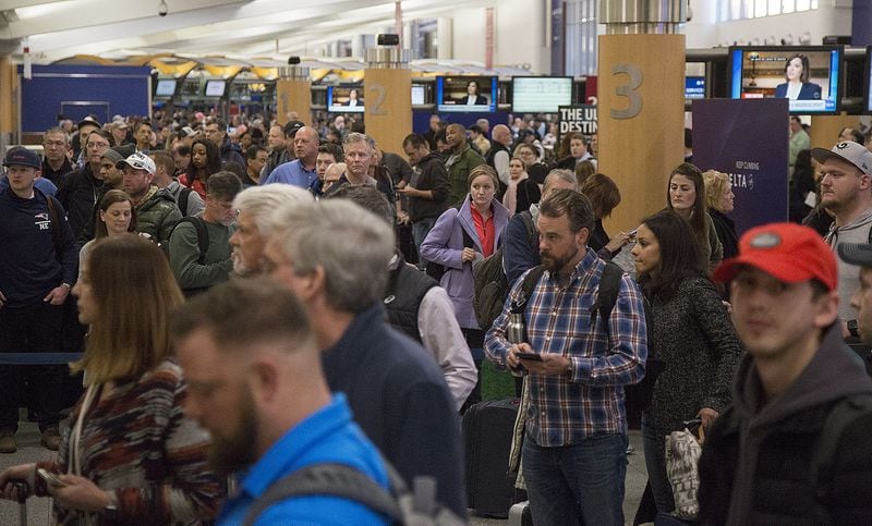 Multiple security lines at Hartsfield-Jackson International Airport snaked through baggage claim then the atrium in both domestic terminals on Monday February 4th, 2019. Official expected over 100,00 travelers to pass through the airport today. (Photo by Phil Skinner)