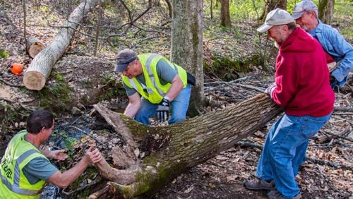 On Park Day 2017,  volunteers remove part of a stump from a creek at Kennesaw Mountain National Battlefield Park. CIVIL WAR TRUST