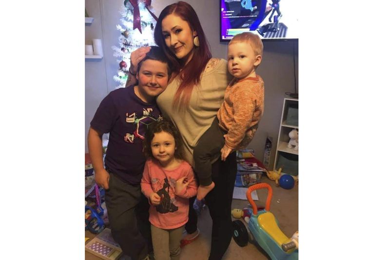 In this undated photo released by legal counsel, Mariah Dodds and her three children pose for a photo. Dodds and her children were attending a birthday party for another child at the Swan Boat Club on April 20, 2024. In the afternoon, Marshella Chidestar crashed her SUV through the wall of the club. Two of the children were killed and the third severely injured as well as Mariah. (Marko Law via AP)