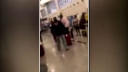 Cellphone video taken Tuesday at Hartsfield-Jackson Airport appears to show Charles Haywood become aggressive with travelers after being denied access to a flight.