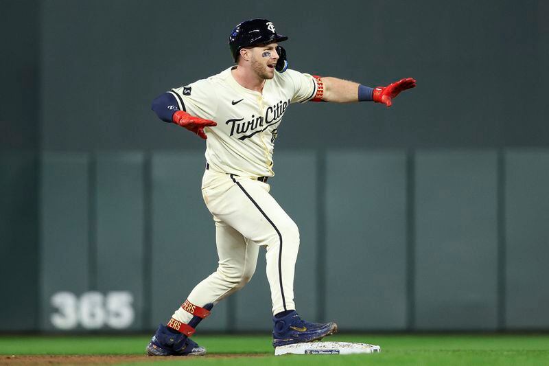Minnesota Twins' Ryan Jeffers celebrates after his two RBI double against the Boston Red Sox during the seventh inning of a baseball game, Friday, May 3, 2024, in Minneapolis. (AP Photo/Matt Krohn)