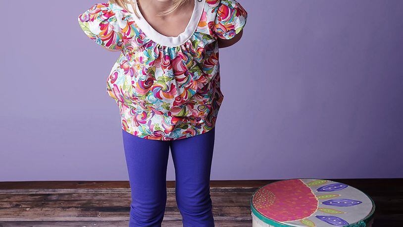 Atlanta’s Emerald August creates timeless children’s clothing in modern colors and prints, like this flutter sleeve tunic top and Lulu leggings. CONTRIBUTED BY HELMUTH PHOTOGRAPHY