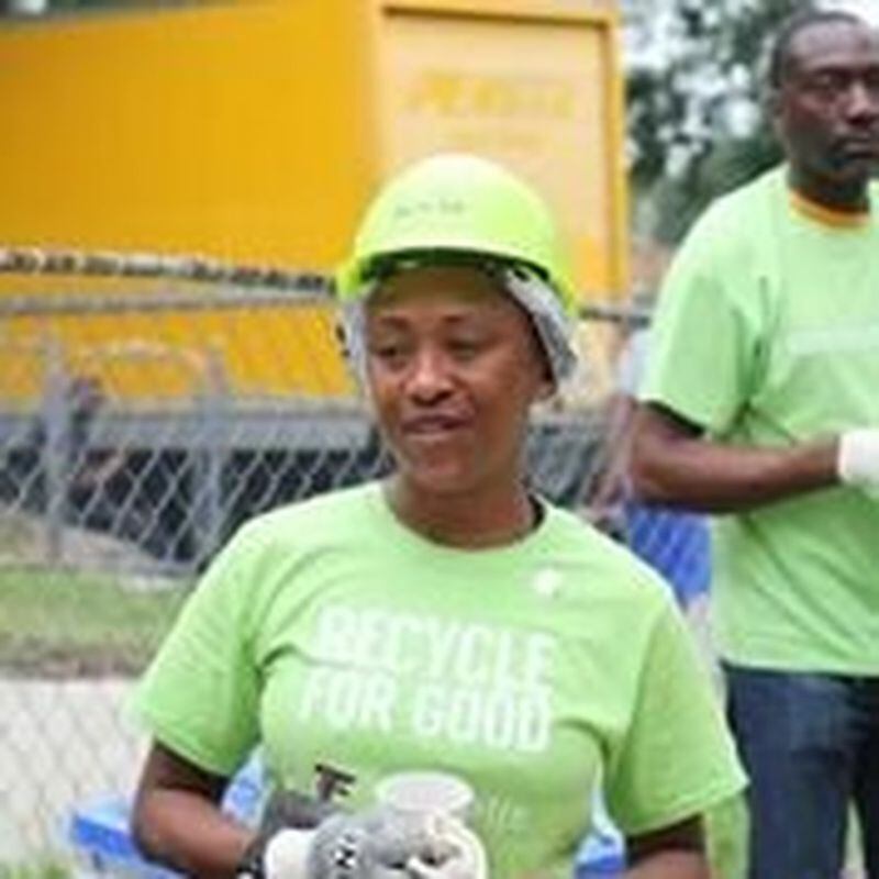 Rashawn Medley takes a break from building her new Habitat for Humanity home. The four-bedroom woodframe house was constructed using proceeds for the sell of aluminum cans collected at Falcons and Atlanta United games. Contributed