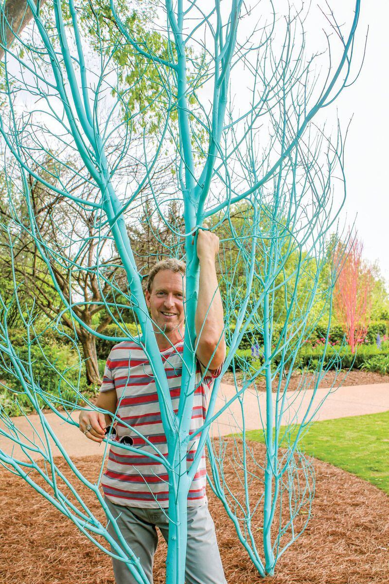  Adam Schwerner, director of horticulture at Disneyland, is taking a vacation in Atlanta and doing what he likes to do best, which is create art. His installation at the Atlanta Botanical Garden hangs orchids from chandeliers, paints a few thousand gourds bright red and dots the grounds with trees painted in ice cream colors. Photo: courtesy Atlanta Botanical Garden