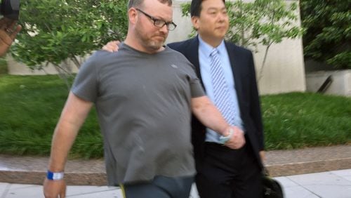 Bryan Moles, left, with attorney Eugene Ohm in Washington on June 1. (AP Photo/Jessica Gresko, File)