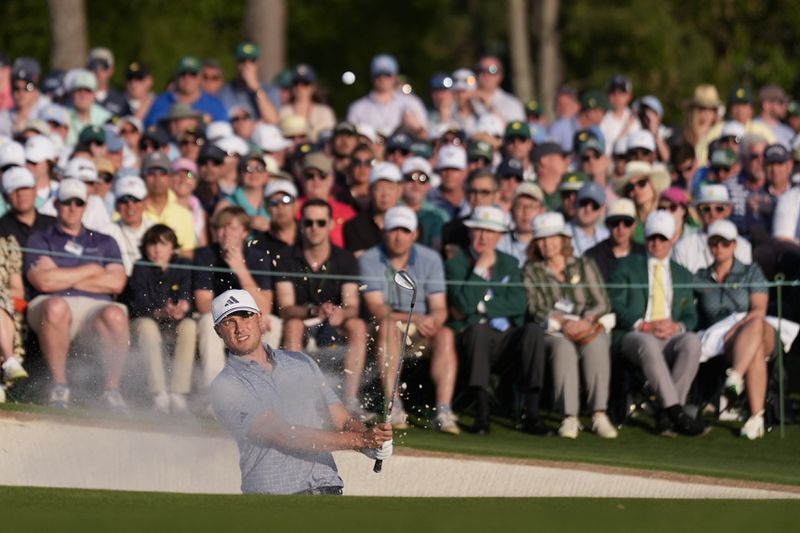 Ludvig Aberg, of Sweden, hits from the bunker on the 18th hole during the final round at the Masters golf tournament at Augusta National Golf Club Sunday, April 14, 2024, in Augusta, Ga. (AP Photo/Ashley Landis)