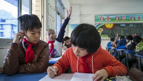 Students attend classes at a primary school in Fuzhou, China,
