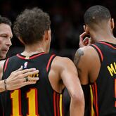 Atlanta Hawks head coach Quin Snyder confers with Atlanta Hawks' guard Trae Young (11) and Atlanta Hawks' guard Dejounte Murray (5) during the second half in Game 3 of the first round of the Eastern Conference playoffs at State Farm Arena, Friday, April 21, 2023, in Atlanta. Atlanta Hawks won 130-122 over Boston Celtics. (Hyosub Shin / Hyosub.Shin@ajc.com)