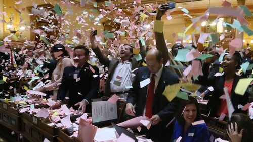 As this year’s legislative session came to a close early Friday morning, senators celebrated by throwing makeshift confetti after considering hundreds of bills. BOB ANDRES / BANDRES@AJC.COM