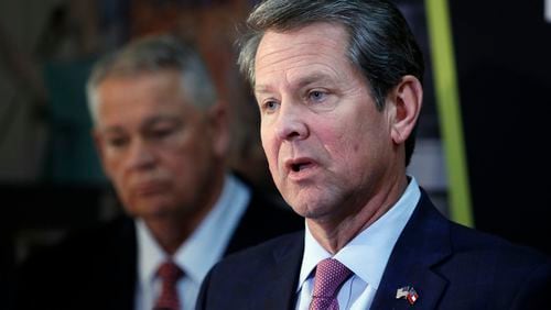 Gov. Brian Kemp (right) and House Speaker David Ralston at a press conference after the passage of SB 106, a measure that could allow the governor to expand Medicaid in Georgia. Bob Andres, bandres@ajc.com