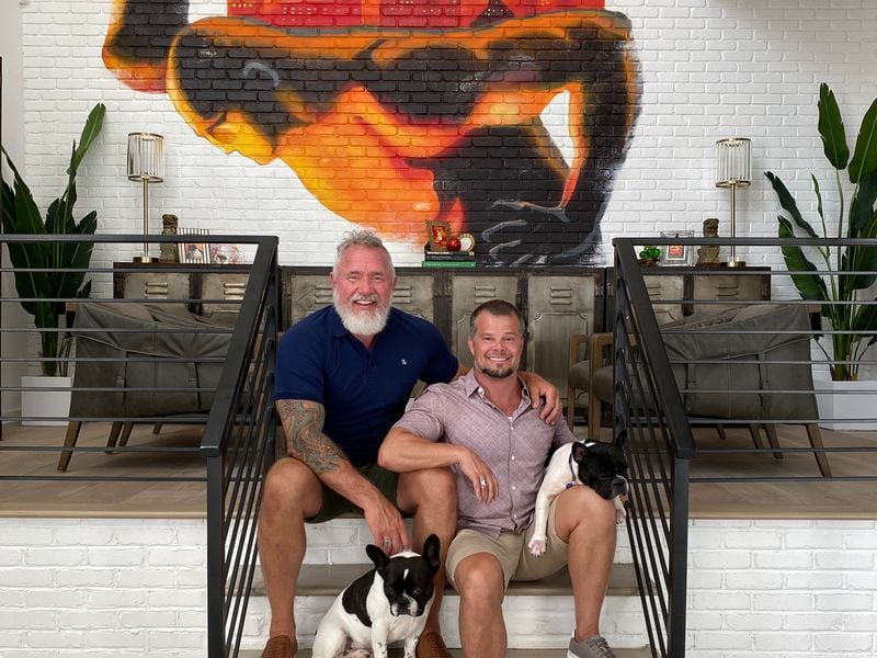 Treadwell and Lirette share their home with their two dogs, Royal and Regal. The main wall of their home has a mural of a cityscape with Atlas holding the city. Courtesy of Helen Chen
