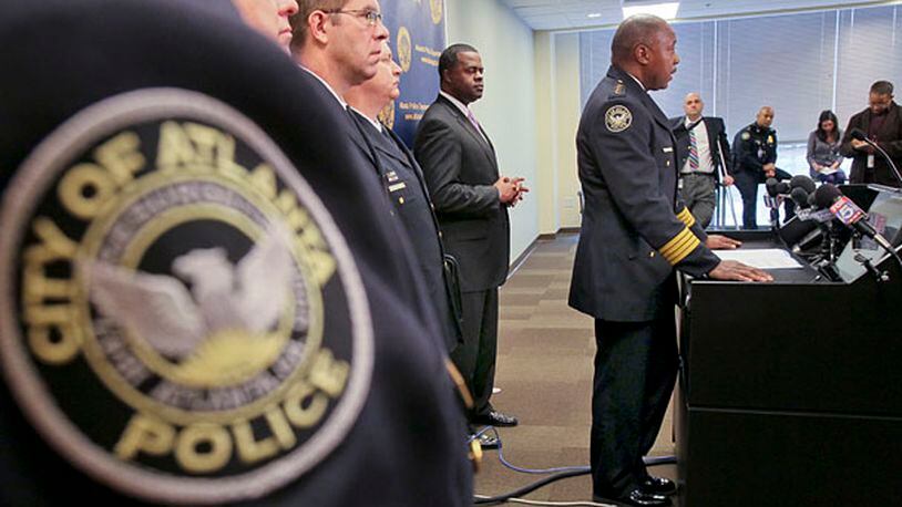 From left, APD Capt. J.P. Spillane, Assistant Chie, P.N. Andresen, Deputy Chief C.W. Moss, Mayor Kasim Reed were on hand as APD Chief George Turner addressed reporters on Monday about the controversial Red Dog narcotics unit. The unit was at the center of the botched Atlanta Eagle raid in 2009.