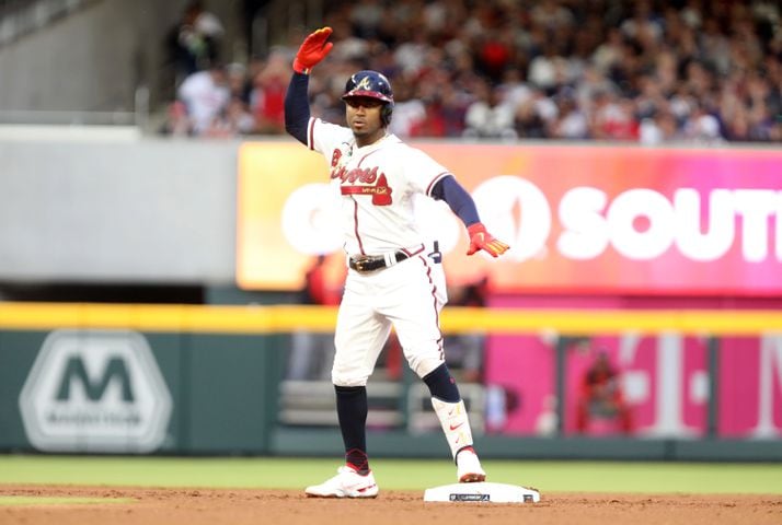 Braves second baseman Ozzie Albies reacts after hitting a double during the first inning Monday night at Truist Park. (Miguel Martinez/miguel.martinezjimenez@ajc.com)