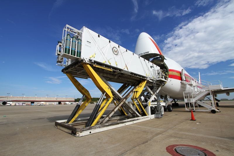 During an exercise earlier this year, a hydraulic lifting device elevates the CBCS container more than 15 feet above the pavement and lines it up with the aircraft floor. Source: Phoenix Air