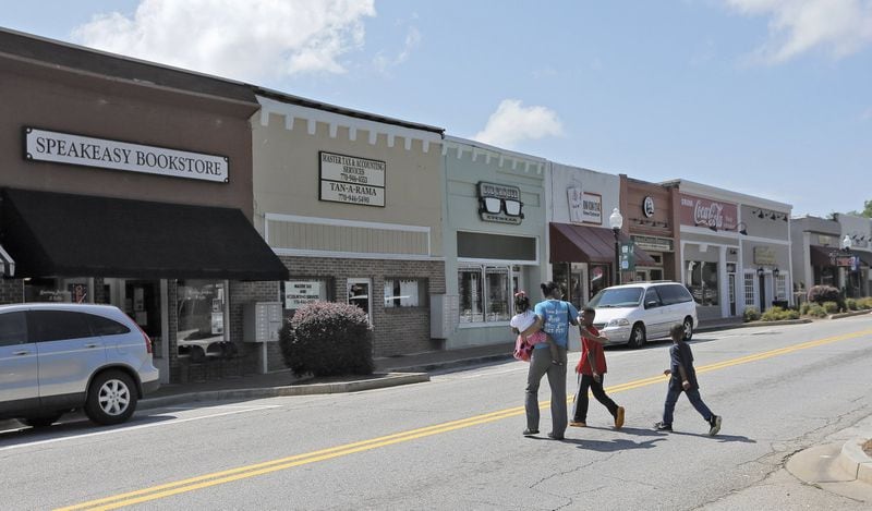 Businesses along E. Main St. South in Hampton. Earlier this month, Henry County joined New Orleans and South Carolina in the rekindled national debate over whether public Confederate memorials honor Southern history or are insensitive monuments to slavery and racial oppression.BOB ANDRES /BANDRES@AJC.COM