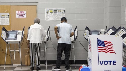People cast their votes during Saturday early voting at the C.T. Martin Natatorium and Recreation Center in Atlanta. (REANN HUBER/REANN.HUBER@AJC.COM)