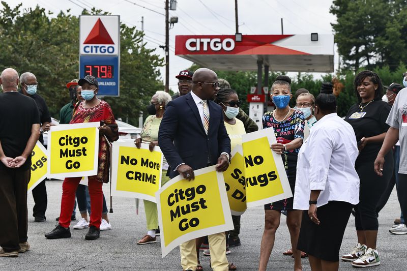 Members of the Adamsville community gather to rally against violent crime at the Citgo gas station on Martin Luther King Jr. Dr in Atlanta  on Wednesday, August 17, 2022. (Natrice Miller/natrice.miller@ajc.com)