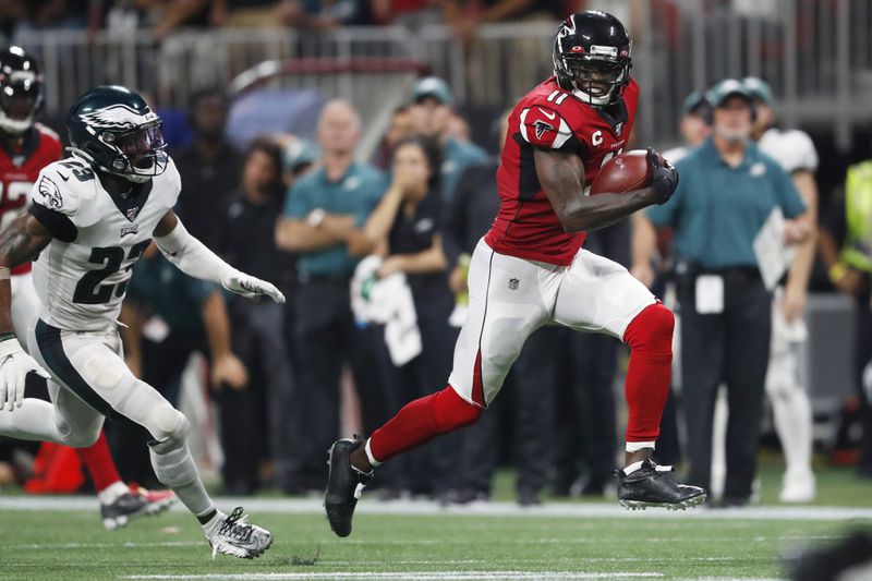 Falcons wide receiver Julio Jones (11) runs toward the end zone for a touchdown against Philadelphia Eagles free safety Rodney McLeod (23) during the second half of an NFL football game in Atlanta, in this Sunday, Sept. 15, 2019, file photo.  (AP Photo/John Bazemore, File)