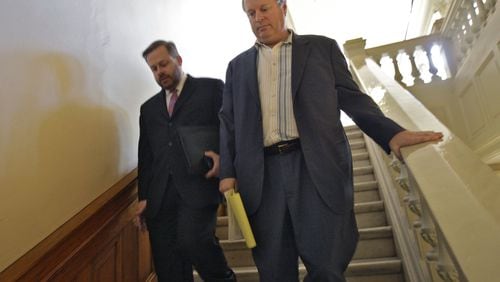 Former state Sen. Don Balfour, right, with attorney Robert Highsmith, in 2012 heads down the steps to the Senate mezzanine meeting room for an ethics hearing. BOB ANDRES / BANDRES@AJC.COM