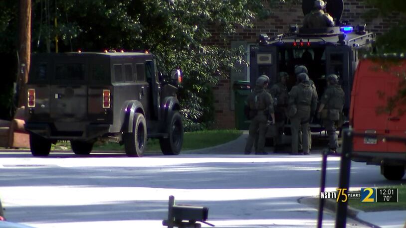 A man was shot by police near the end of a SWAT standoff in DeKalb County, police said.