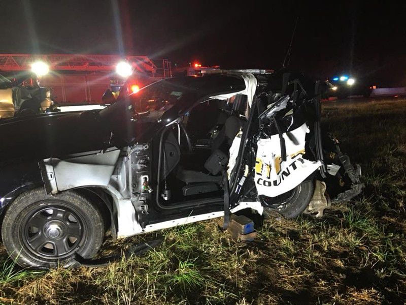 A Forsyth County Sheriff's Office deputy  was injured in 2017 when a vehicle driven by a suspected DUI driver crashed into his parked patrol car on Ga. 400. (Photo: Forsyth County Sheriff's Office)