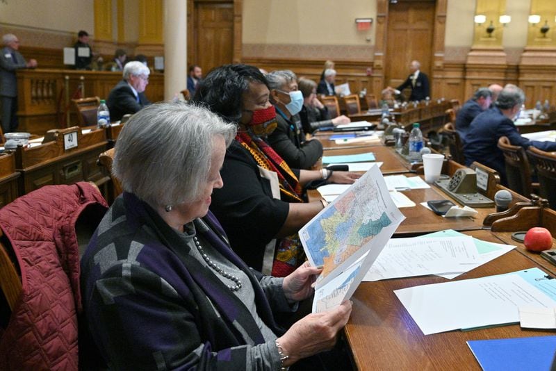 State Sen. Nan Orrock, D-Atlanta, examines a newly drawn map of Georgia's congressional districts during a special legislative session in November. (Hyosub Shin / Hyosub.Shin@ajc.com)