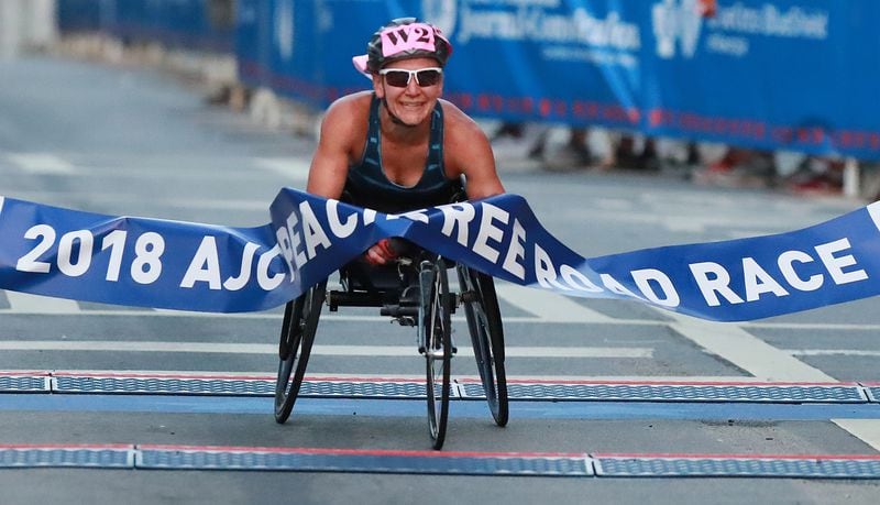 Susannah Scaroni wins the women's wheelchair race during the AJC Peachtree Road Race on Wednesday, July 4, 2018, in Atlanta. Curtis Compton/ccompton@ajc.com