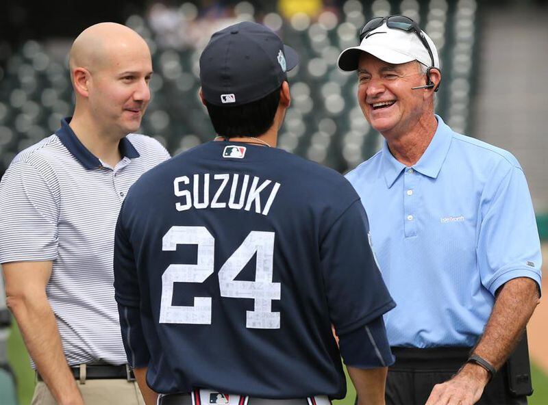  Then-Braves GM John Coppolella (left) and president of baseball operations John Hart chatted with veteran catcher Kurt Suzuki at spring training. Hart is now serving as GM until a permanent replacement is hired after Coppolella was forced to resign amid an MLB investigation. (Curtis Compton/AJC photo)