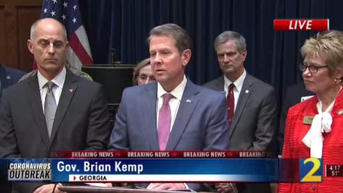 Gov. Brian Kemp addresses the media Thursday. Flooding in Georgia prompted him to issue a state of emergency.