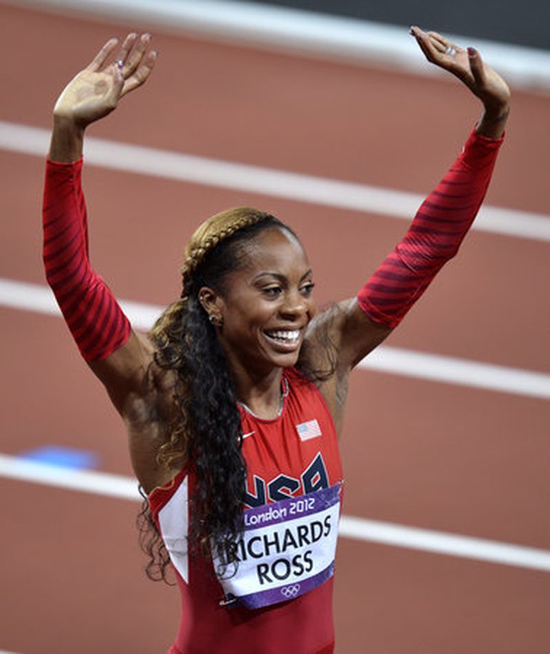 United States' Sanya Richards-Ross celebrates her win in the women's 400-meter final during the athletics in the Olympic Stadium at the 2012 Summer Olympics, London, Sunday, Aug. 5, 2012.