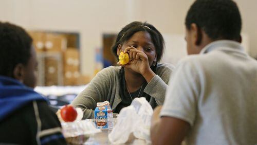Summer-school students including eighth-grader Tatiana Hardy participate in the summer food program, in which Dekalb County employees prepare more than 4,000 lunches daily at Mary McLeod Bethune Middle School. BOB ANDRES / BANDRES@AJC.COM