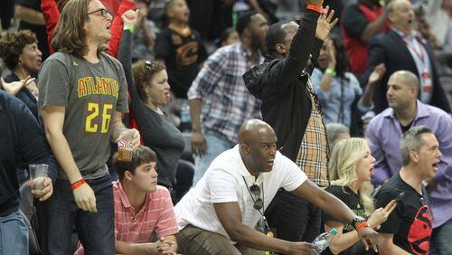 Fans react in an NBA game between the Atlanta Hawks and Cleveland Cavaliers at Phillips Arena in Atlanta, Georgia, on April 9, 2017. The Hawks won in overtime 126-125 after coming back from being 26 points down in the fourth quarter. (HENRY TAYLOR / HENRY.TAYLOR@AJC.COM)