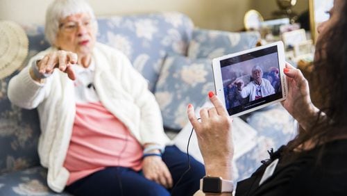 Irene Skurla is interviewed by Vibrant Life Director Lynn Brink, who uses the OneDay app for senior citizens, on Tuesday, July 24, 2018 at The Village at Mapleshade in Plano, Texas. The app allows staff members to interview residents, then send the videos to residents’ family members. (Ashley Landis/Dallas Morning News/TNS)