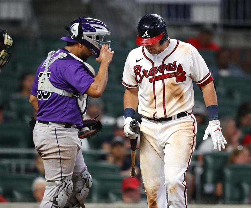 Braves third baseman Austin Riley reacts to striking out to end the game in a 3-2 loss to the Colorado Rockies with catcher Elias Diaz heading to the celebration during the ninth inning in a MLB baseball game on Tuesday, August 30, 2022, in Atlanta.   “Curtis Compton / Curtis Compton@ajc.com