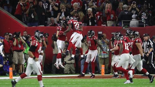 Devonta Freeman #24 of the Atlanta Falcons celebrates a 5-yard touchdown in the second quarter with teammates against the New England Patriots during Super Bowl 51 at NRG Stadium on February 5, 2017 in Houston, Texas.  (Photo by Patrick Smith/Getty Images)