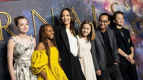 Angelina Jolie dropped off her daughter Zahara (second from left) at Spelman College in downtown Atlanta this week. In this photo, Shiloh Jolie-Pitt (from left), Zahara Jolie-Pitt, Angelina Jolie, Vivienne Jolie-Pitt, Maddox Jolie-Pitt and Knox Jolie-Pitt pose for photographers upon arrival at the premiere of the film "Eternals" on Wednesday, Oct. 27, 2021, in London. (Photo by Vianney Le Caer/Invision/AP)