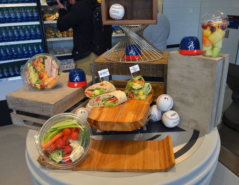 170323 Atlanta, Ga (Suntrust Park): Salads, rollups, fruits and gluten free hotdogs will be avilable from the Centerfield Market at Suntrust Park for the 2017 Braves season. The Atlanta Braves and Delaware North Sportservice, the hospitality and food service provider for the Atlanta Braves, host a tasting tour of the soon to be opened Suntrust Park to reveal the food and beverage options available for the 2017 season. All photos taken Thursday March 23, 2017 at Suntrust Park 755 Battery Avenue, Smyrna, Ga 30339. (Chris Hunt/Special) for story slugged 041417Bravesdishes
