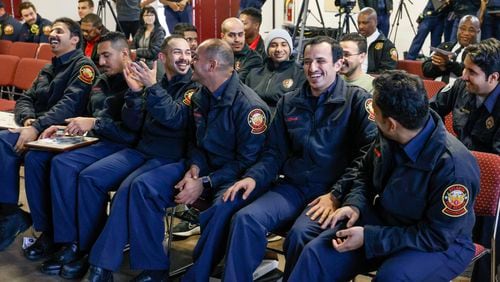 Six Saudi Aramco firefighters are all smiles after they graduated from a six-month international training program with the Atlanta Fire and Rescue Department.