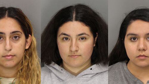 From left to right are Israa Mohamedeh Ayyad, Lytzy Herrea and Noemi Ramirez, who are charged with felony theft by deception. Credit: Cobb County Sheriff’s Office