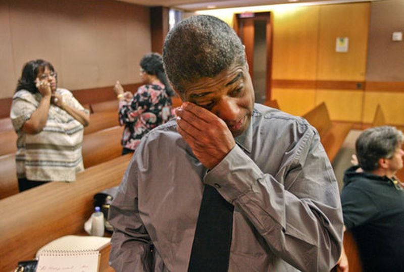 Bennet Reid, father of Sparkle Rai, wipes the tears away after the verdict in a Fulton County courtroom in Atlanta in 2008. Sixty-eight-year-old Chiman Rai, a Mississippi businessman born in India, was found guilty on charges that he arranged to have a hitman murder his African-American daughter-in-law.