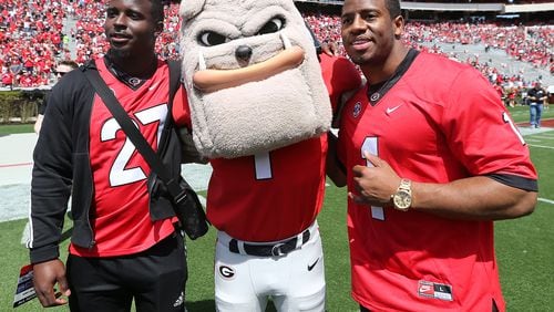 Former UGA running backs Sony Michel (left) and Nick Chubb, wearing each others jersey, are on hand for Georgia's annual G-Day spring intrasquad football game on Saturday, April 21, 2018, in Athens.  Curtis Compton/ccompton@ajc.com