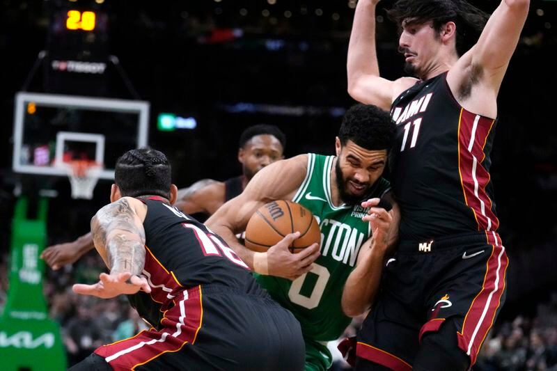 Boston Celtics forward Jayson Tatum drives to the basket through the Miami Heat during the first half Game 2 of an NBA basketball first-round playoff series, Wednesday, April 24, 2024, in Boston. (AP Photo/Charles Krupa)