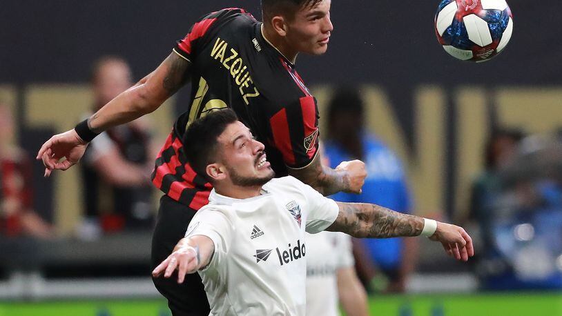 July 21, 2019 Atlanta: Atlanta United forward Brandon Vazquez heads the ball past a D.C. United defender during a 2-0 victory in their soccer match on Sunday, July 21, 2019, in Atlanta.   Curtis Compton/ccompton@ajc.com