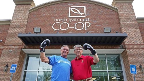 Suwanee Mayor Jimmy Burnette and Sugar Hill Mayor Brandon Hembree put on their boxing gloves for a friendly "food fight" to raise donations for the North Gwinnett Co-op. (Courtesy City of Suwanee)